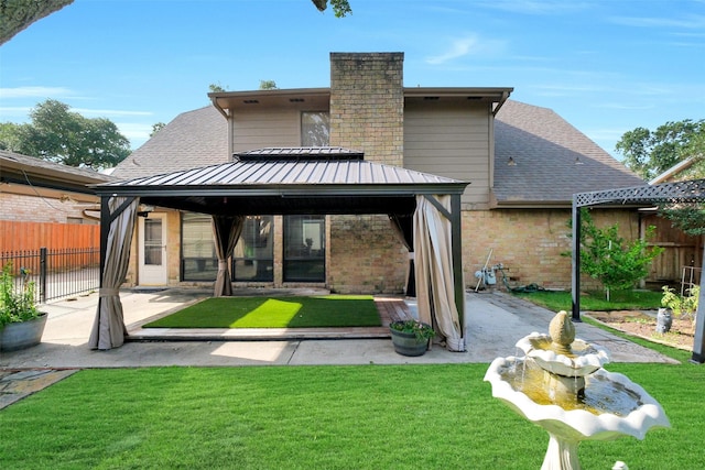 21307 Park Willow Dr, Katy, TX 77450 - rear view of property with a gazebo, a patio area, brick siding, roof with shingles, and a chimney