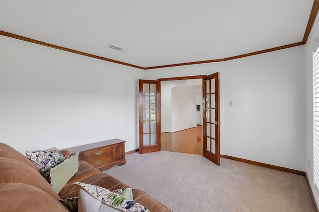 21307 Park Willow Dr, Katy, TX 77450 - living area featuring french doors, crown molding, light carpet, and healthy amount of natural light
