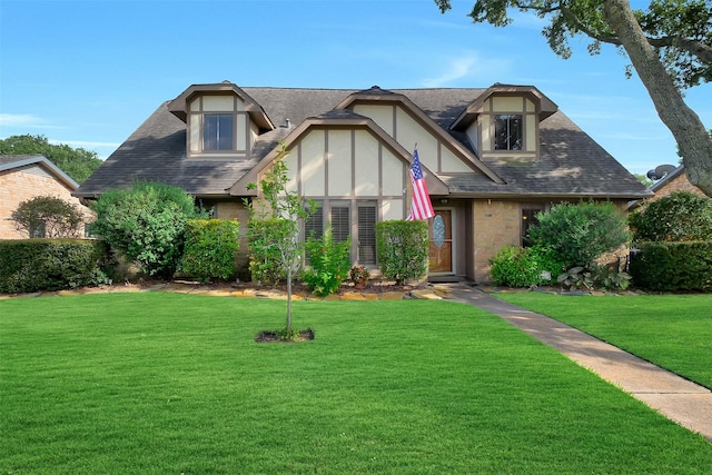 21307 Park Willow Dr, Katy, TX 77450 - tudor house with a front lawn and roof with shingles