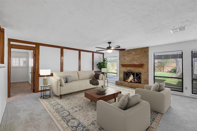 21307 Park Willow Dr, Katy, TX 77450 - living room featuring plenty of natural light, light carpet, ceiling fan, and a textured ceiling