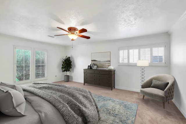21307 Park Willow Dr, Katy, TX 77450 - carpeted bedroom featuring multiple windows, ceiling fan, crown molding, and a textured ceiling