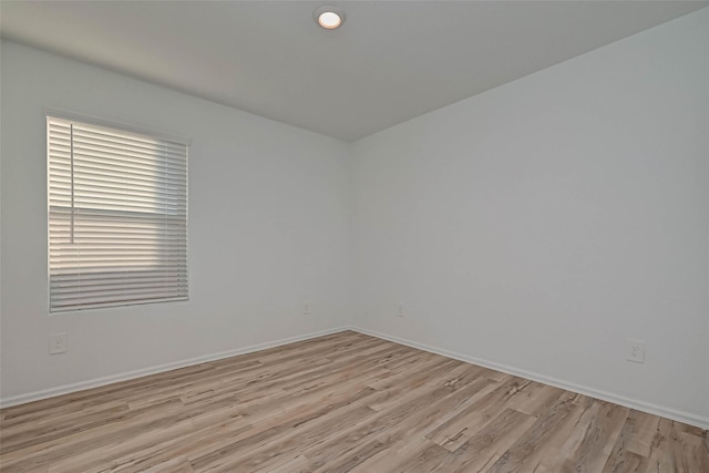 22156 Juniper Crossing Dr, New Caney, TX 77357 - unfurnished room featuring light wood-type flooring and baseboards