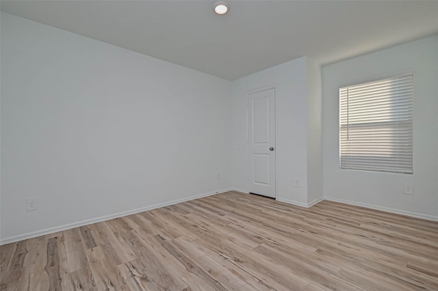22156 Juniper Crossing Dr, New Caney, TX 77357 - unfurnished room with light wood-type flooring and baseboards