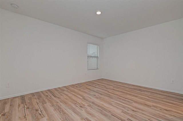 22156 Juniper Crossing Dr, New Caney, TX 77357 - empty room with light wood-type flooring and baseboards