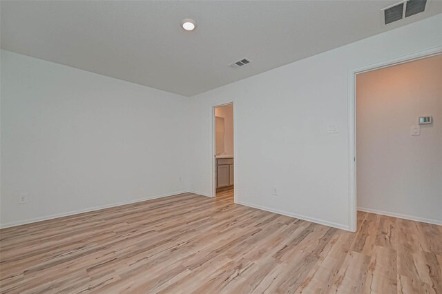 22156 Juniper Crossing Dr, New Caney, TX 77357 - empty room featuring light wood-style floors and baseboards