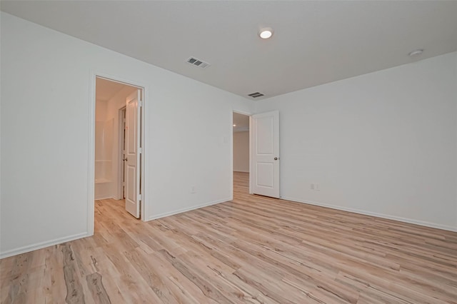 22156 Juniper Crossing Dr, New Caney, TX 77357 - empty room featuring light wood-type flooring and a smoke detector