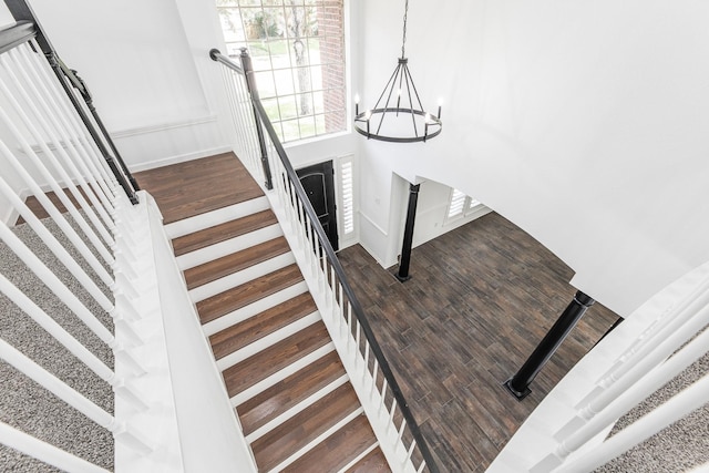 20411 Avery Point Dr, Katy, TX 77449 - stairway featuring a chandelier and wood finished floors