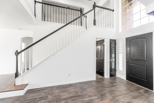 20411 Avery Point Dr, Katy, TX 77449 - entrance foyer with a towering ceiling, wood finished floors, stairway, and arched walkways