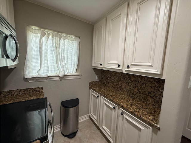 2330 Lakewood Yacht Club Dr Unit 7, Seabrook, TX 77586 - laundry area with light tile patterned floors and baseboards