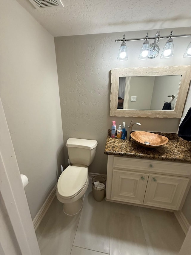 2330 Lakewood Yacht Club Dr Unit 7, Seabrook, TX 77586 - half bath with a textured ceiling, vanity, and tile patterned flooring