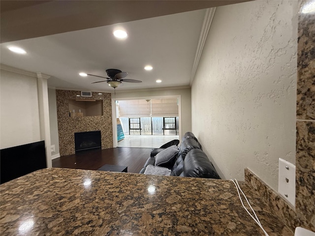 2330 Lakewood Yacht Club Dr Unit 7, Seabrook, TX 77586 - living room featuring ornamental molding, a fireplace, a ceiling fan, wood finished floors, and recessed lighting