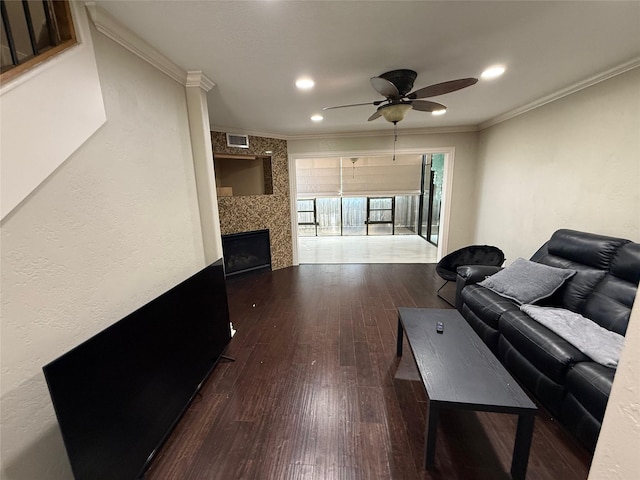 2330 Lakewood Yacht Club Dr Unit 7, Seabrook, TX 77586 - living room with hardwood / wood-style floors, a tiled fireplace, a ceiling fan, ornamental molding, and recessed lighting