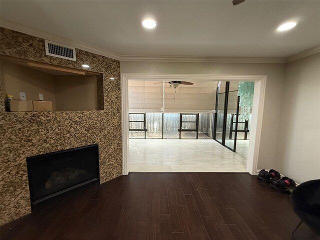 2330 Lakewood Yacht Club Dr Unit 7, Seabrook, TX 77586 - unfurnished living room with dark wood-style floors, crown molding, a ceiling fan, a fireplace, and recessed lighting