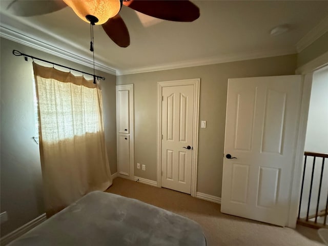 2330 Lakewood Yacht Club Dr Unit 7, Seabrook, TX 77586 - bedroom with ornamental molding, carpet flooring, a ceiling fan, and two closets