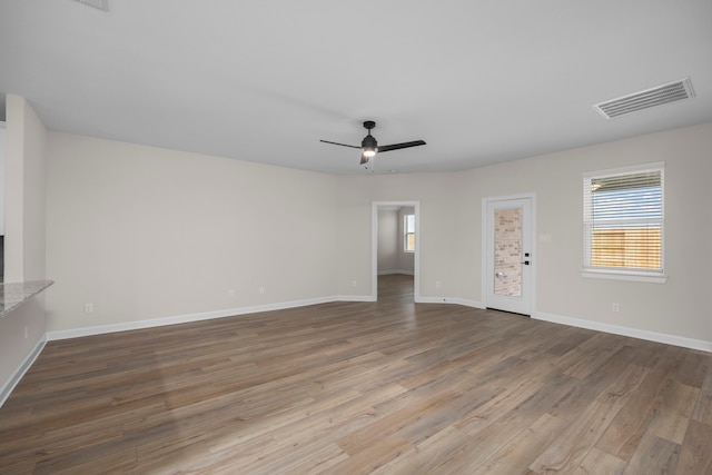 3102 Banyan Dr, Texas City, TX 77510 - unfurnished living room featuring wood finished floors and ceiling fan