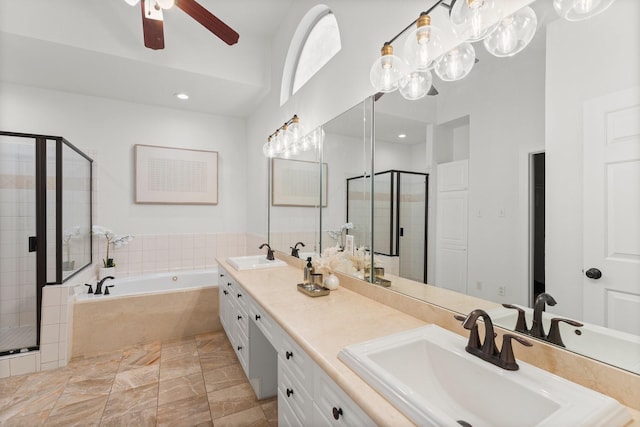 817 Rosine St, Houston, TX 77019 - full bath featuring a stall shower, a bath, double vanity, a ceiling fan, and recessed lighting