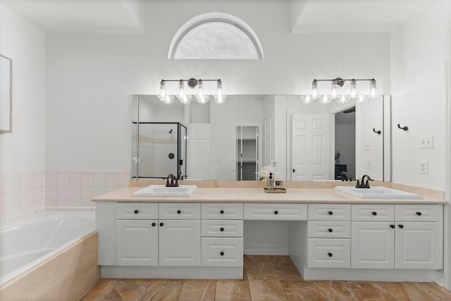 817 Rosine St, Houston, TX 77019 - full bath featuring a stall shower, double vanity, and a garden tub