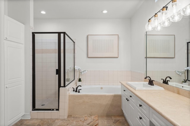 817 Rosine St, Houston, TX 77019 - full bathroom featuring a bath, a shower stall, vanity, and recessed lighting