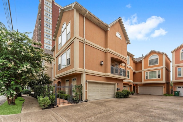 817 Rosine St, Houston, TX 77019 - view of building exterior featuring an attached garage and driveway