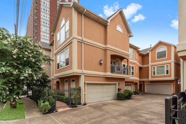 817 Rosine St, Houston, TX 77019 - view of building exterior with a garage and driveway