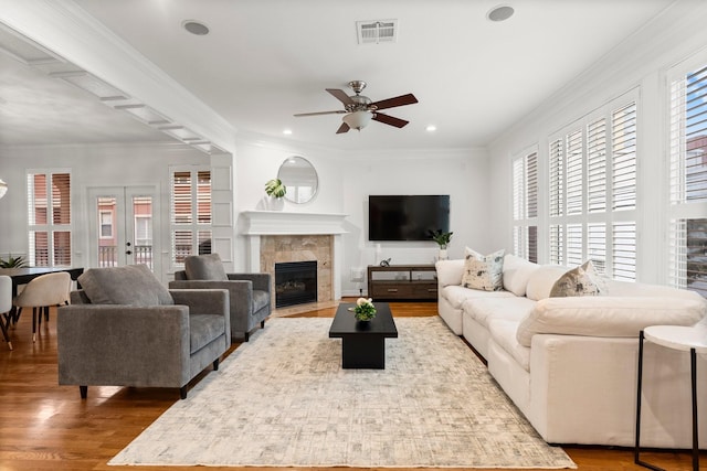 817 Rosine St, Houston, TX 77019 - living area featuring ceiling fan, wood finished floors, a fireplace, recessed lighting, and ornamental molding