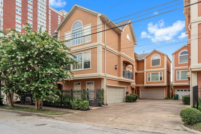 817 Rosine St, Houston, TX 77019 - multi unit property featuring stucco siding, a garage, and driveway