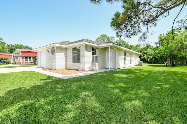 1117 Delores St, Kemah, TX 77565 - view of home's exterior featuring a yard, brick siding, an attached garage, concrete driveway, and roof with shingles