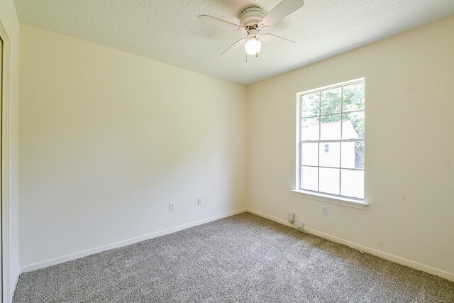1117 Delores St, Kemah, TX 77565 - spare room with ceiling fan, carpet floors, and a textured ceiling