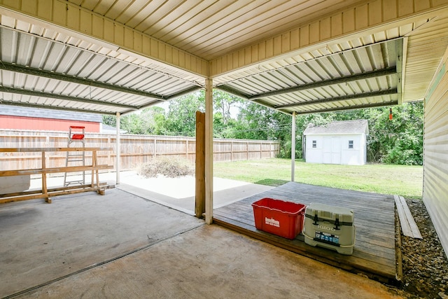 1117 Delores St, Kemah, TX 77565 - view of patio / terrace with a wooden deck and a storage shed