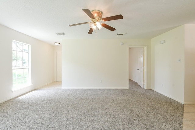 1117 Delores St, Kemah, TX 77565 - spare room featuring a ceiling fan and light colored carpet