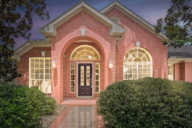 13615 Mierwood Manor Dr, Cypress, TX 77429 - exterior entry at dusk with brick siding