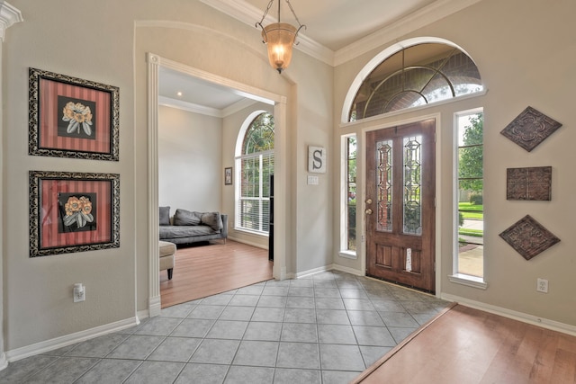 13615 Mierwood Manor Dr, Cypress, TX 77429 - foyer entrance with plenty of natural light, ornamental molding, and light tile patterned flooring