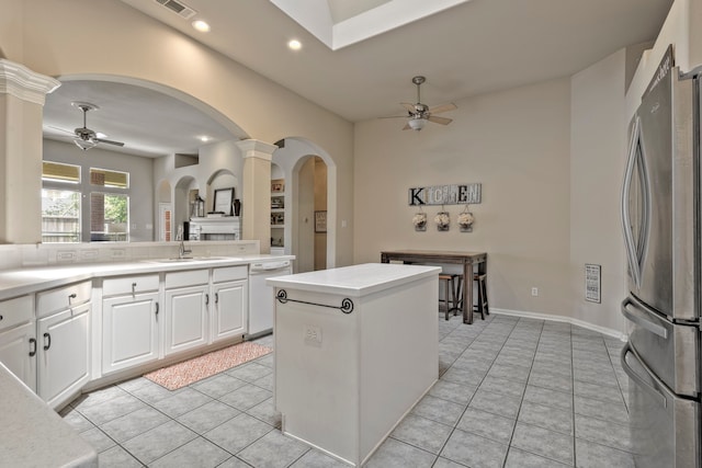 13615 Mierwood Manor Dr, Cypress, TX 77429 - kitchen with freestanding refrigerator, a ceiling fan, arched walkways, decorative columns, and recessed lighting