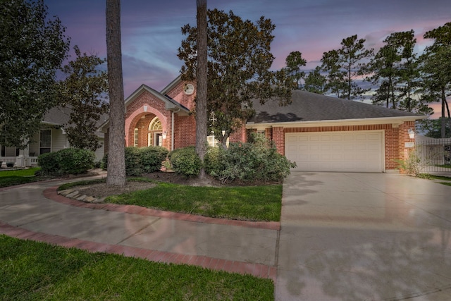 13615 Mierwood Manor Dr, Cypress, TX 77429 - view of front facade featuring an attached garage, driveway, and brick siding