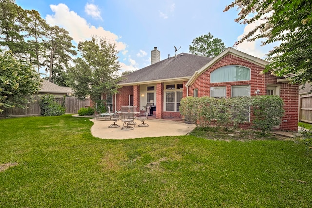 13615 Mierwood Manor Dr, Cypress, TX 77429 - rear view of house with brick siding, a patio, a chimney, and roof with shingles
