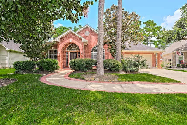 13615 Mierwood Manor Dr, Cypress, TX 77429 - view of front facade with brick siding, an attached garage, a front lawn, and driveway