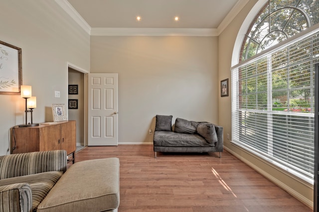 13615 Mierwood Manor Dr, Cypress, TX 77429 - sitting room featuring crown molding, light wood finished floors, and a towering ceiling