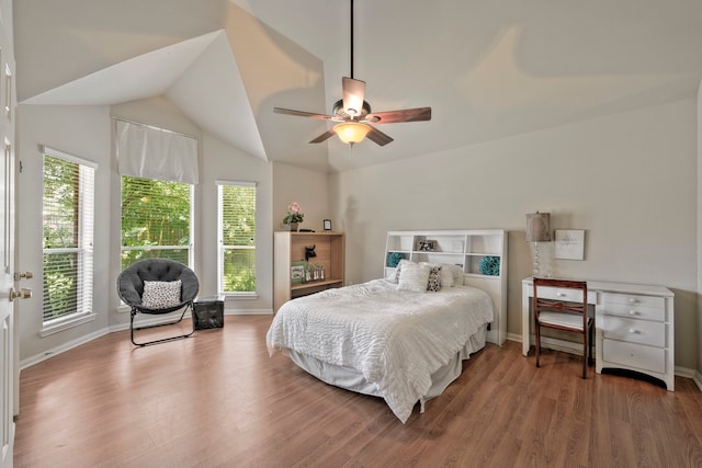 13615 Mierwood Manor Dr, Cypress, TX 77429 - bedroom with wood finished floors, vaulted ceiling, and ceiling fan