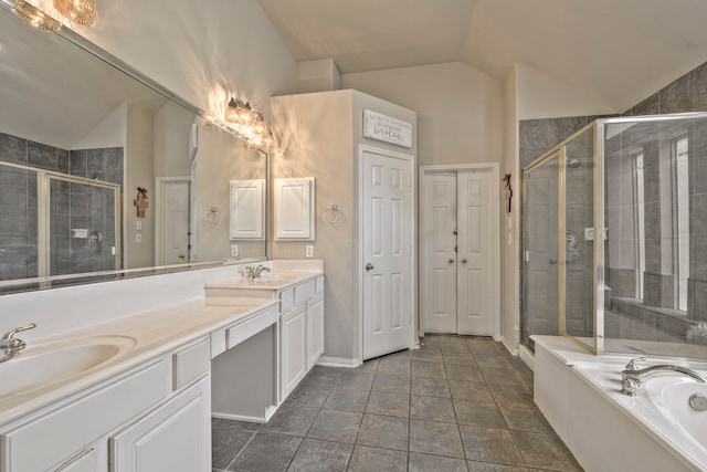13615 Mierwood Manor Dr, Cypress, TX 77429 - bathroom featuring lofted ceiling, double vanity, a shower stall, and a bath