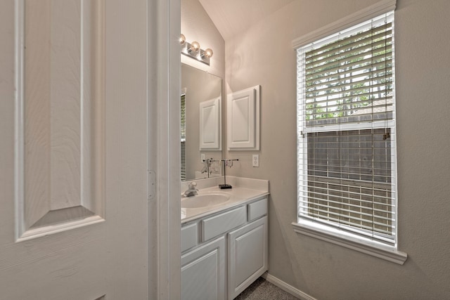 13615 Mierwood Manor Dr, Cypress, TX 77429 - bathroom featuring vanity and vaulted ceiling