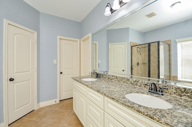 28722 Maple Red Dr, Katy, TX 77494 - full bathroom featuring a shower stall, double vanity, and tile patterned floors