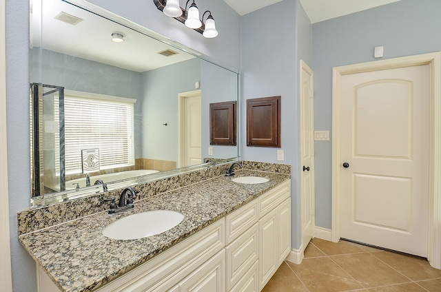 28722 Maple Red Dr, Katy, TX 77494 - bathroom with a garden tub, tile patterned flooring, double vanity, and a stall shower