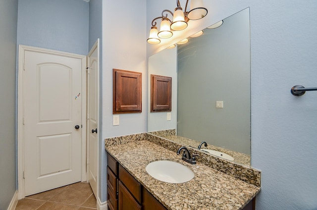 28722 Maple Red Dr, Katy, TX 77494 - bathroom with vanity, tile patterned floors, and a chandelier