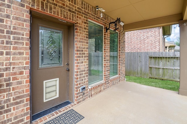 28722 Maple Red Dr, Katy, TX 77494 - view of exterior entry featuring brick siding and covered porch