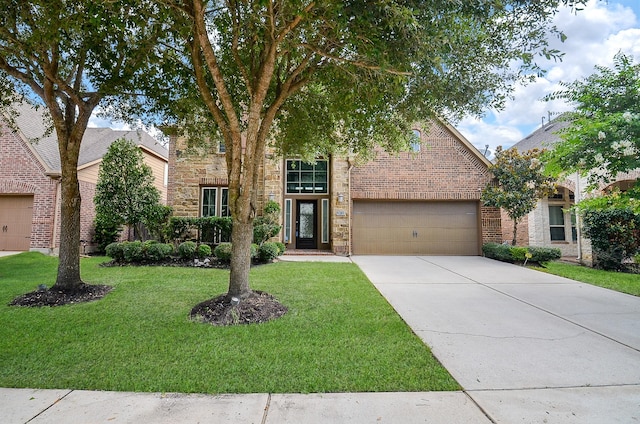 28722 Maple Red Dr, Katy, TX 77494 - view of front of house featuring a front lawn, driveway, brick siding, and a garage