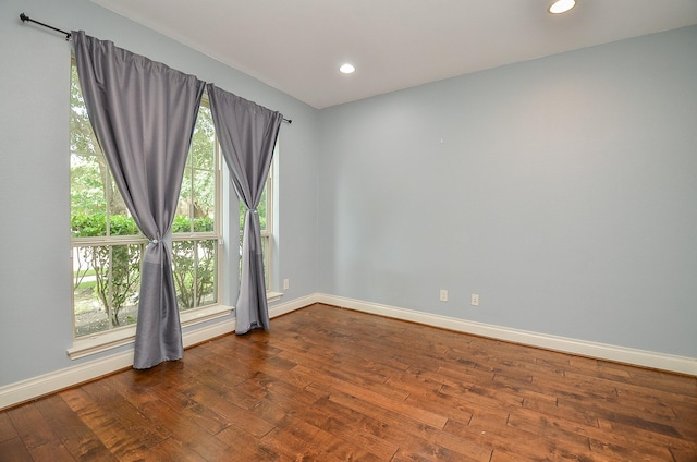 28722 Maple Red Dr, Katy, TX 77494 - spare room featuring plenty of natural light, dark wood-type flooring, and recessed lighting