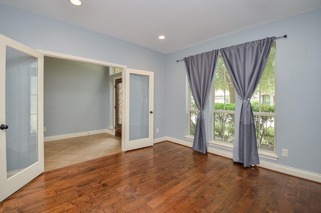 28722 Maple Red Dr, Katy, TX 77494 - unfurnished room featuring french doors, hardwood / wood-style floors, and recessed lighting