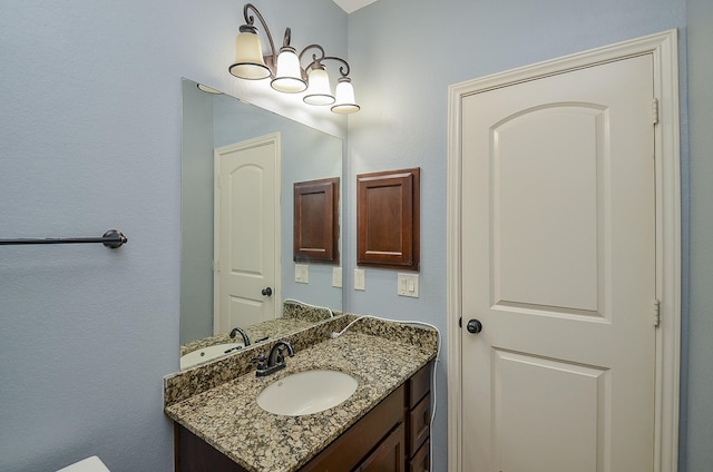 28722 Maple Red Dr, Katy, TX 77494 - bathroom with vanity and a chandelier