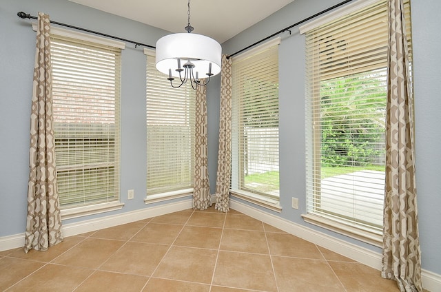 28722 Maple Red Dr, Katy, TX 77494 - unfurnished dining area featuring a chandelier and tile patterned flooring