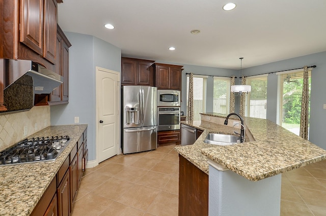 28722 Maple Red Dr, Katy, TX 77494 - kitchen with appliances with stainless steel finishes, backsplash, healthy amount of natural light, a large island, and recessed lighting